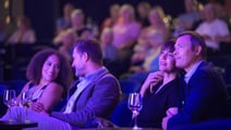 Group of individuals in a theatre watching the evening show.