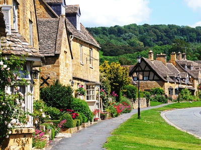 Immerse yourself in the beauty of the Cotswolds with a row of charming houses lining the streets.