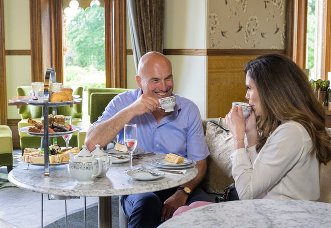 Guests enjoying afternoon tea in the Oak Room at Studley Castle Hotel