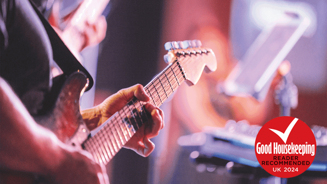 Band playing guitar with Good Housekeeping stamp of approval