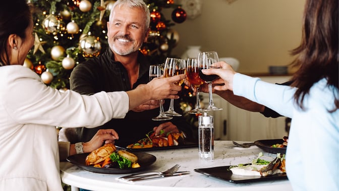 Couple enjoying a festive meal with wine