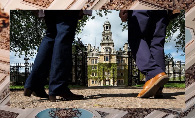 Two guests approach the incredible building at Thoresby Hall, a Warner Hotel